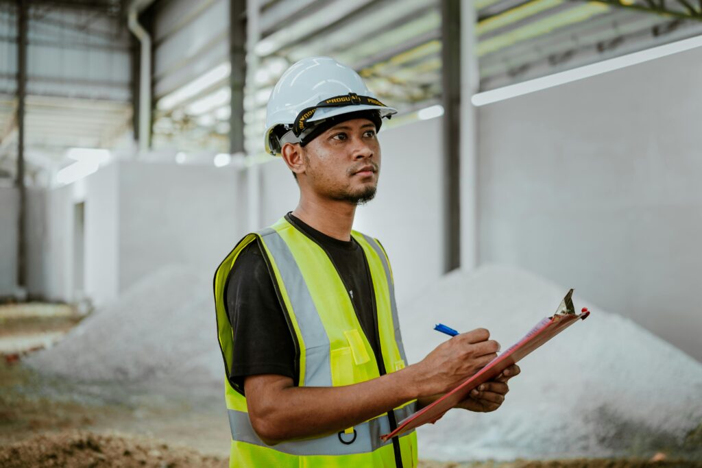 Pexels photo 28196491 28196491 Asian construction worker in a factory setting, using a clipboard for inspection tasks in banting, malaysia.