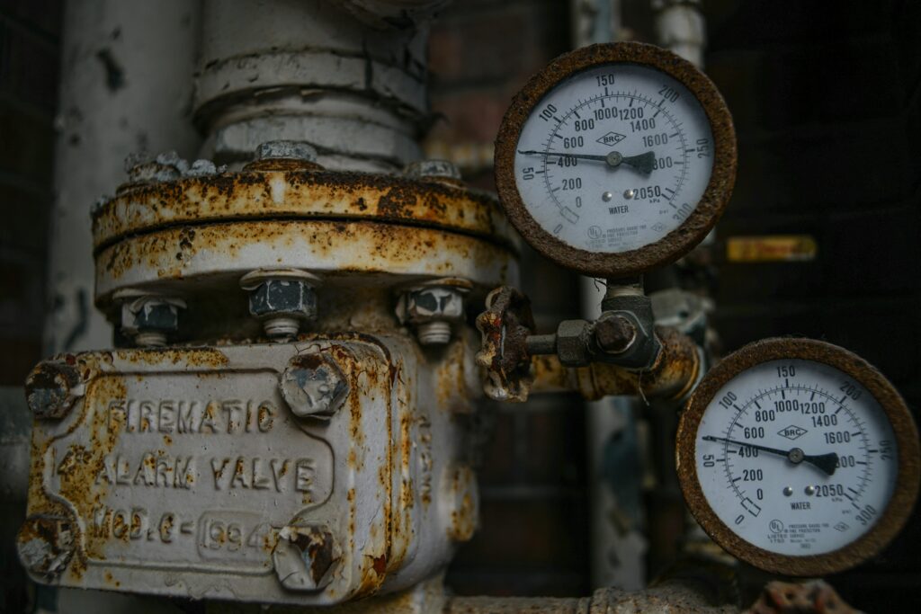 Pexels photo 7865898 7865898 Close-up of an aged and rusted pressure valve with gauges showing readings.