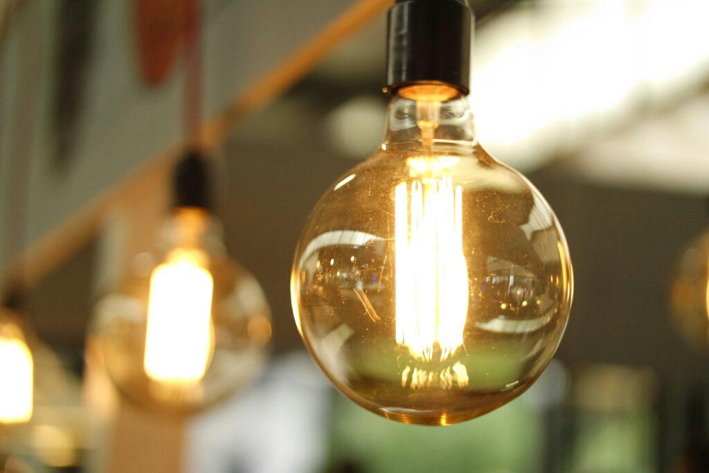 A close-up of a glowing vintage edison bulb creating a warm atmosphere.